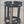 Black metal stand with horizontal bars on a concrete surface